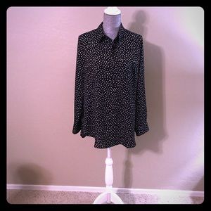 Black and white polka dot blouse.